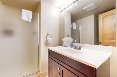 a bathroom with a sink and a mirror at Basecamp Bliss in Olympic Valley
