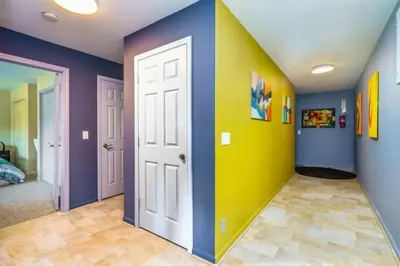 a room with colorful walls and a white door at Massive 8 bedroom on the lake in Groveland