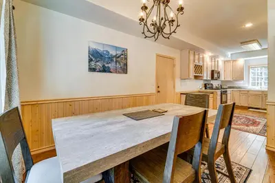 a kitchen with a wooden table and chairs at Truckee Retreat half Mi to Tahoe Donner Skiing in Truckee