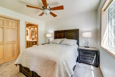 a bedroom with a bed and a ceiling fan at Truckee Retreat half Mi to Tahoe Donner Skiing in Truckee