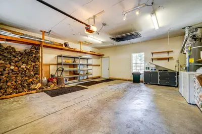 a large room with a pile of fire wood in it at Truckee Retreat half Mi to Tahoe Donner Skiing in Truckee