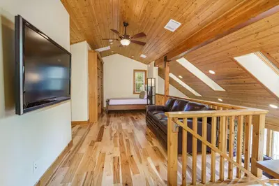 a living room with a ceiling fan and a television at Beautiful 3bd Sanctuary Inside Yosemite in Wawona