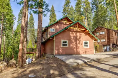 a house in the middle of a forest at Beautiful 3bd Sanctuary Inside Yosemite in Wawona