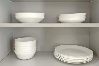 three plates and bowls sitting on a shelf at #LazyBear Tahoe Dreamy Escape in Tahoe Vista