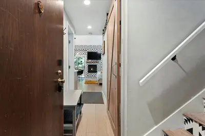 a hallway of a house with a door and a staircase at #LazyBear Tahoe Dreamy Escape in Tahoe Vista