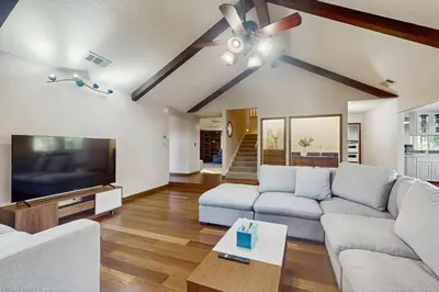 a living room with a couch and a tv at Deer Paradise in Coarsegold