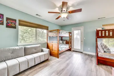 a living room with a couch and bunk beds at Hot Tub, Games and Sports Luxury Yosemite Escape in Oakhurst