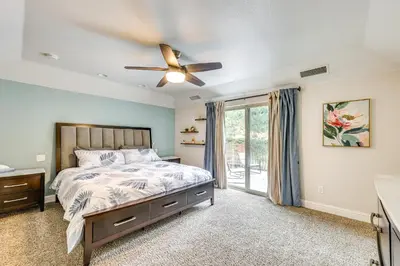 a bedroom with a bed and a ceiling fan at Hot Tub, Games and Sports Luxury Yosemite Escape in Oakhurst
