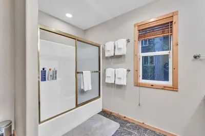 a bathroom with a shower and a window at Modern Retreat in Truckee with AC and Game Room in Truckee