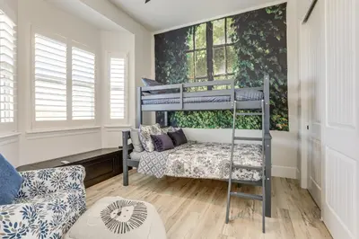 a room with a bunk bed and a couch at 8 Mi to Lodi Lake Luxe Home with On-Site Vineyard in Acampo