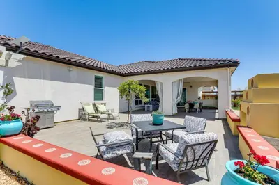 a patio with a table and chairs and a grill at 8 Mi to Lodi Lake Luxe Home with On-Site Vineyard in Acampo
