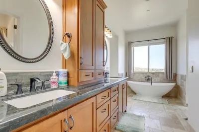 a bathroom with a tub and a sink and a bath tub at On-Site Vineyard Gem on 10 Acres in Pilot Hill! in Pilot Hill