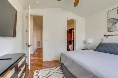 a bedroom with a bed and a flat screen tv at On-Site Vineyard Gem on 10 Acres in Pilot Hill! in Pilot Hill