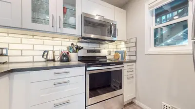 a kitchen with white cabinets and a stove top oven at Hidden Valley #41 condo in Mammoth Lakes