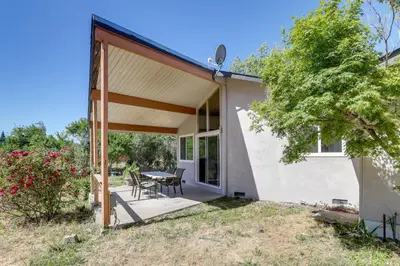 a house with a patio with a table and chairs at 4 Mi to Folsom Lake Modern Home with Patio! in Granite Bay