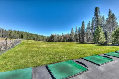 an image of a golf course with green grass and trees at Relax Inn - Close to Attractions Galore in Truckee