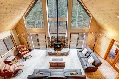 an overhead view of a living room in a tree house at Serenity at Tahoe Donner with Large Balcony in Truckee