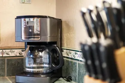 a coffee pot sitting on top of a counter at Serenity at Tahoe Donner with Large Balcony in Truckee