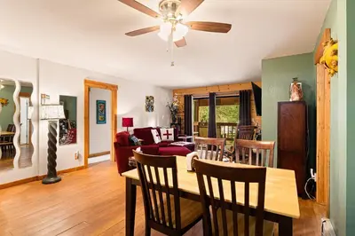 a dining room and living room with a ceiling fan at Sierra Pines Retreat - Sleeps 6 in Incline Village