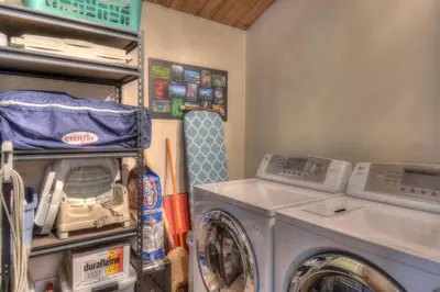 a laundry room with a washer and a washing machine at Silver Tree Sanctuary in Aspen Grove in Truckee