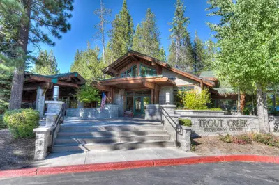 a resort building with stairs leading to the front gate at Skislope Sanctuary - Close to Outdoor Activities in Truckee