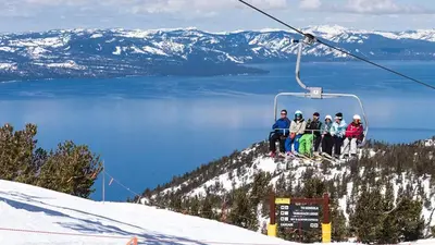 a group of people sitting on a ski lift at Tahoe Frost - Air conditioned 4 bedroom Tahoe home in South Lake Tahoe