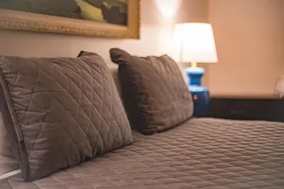 a bed with two pillows in a hotel room at Tahoe Lakeside Retreat - Lakefront Condo in South Lake Tahoe