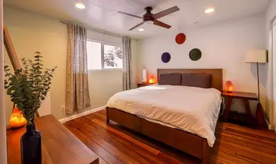 a bedroom with a bed and a ceiling fan at Tahoe Trail Retreat - Steps from the TRT in Zephyr Cove