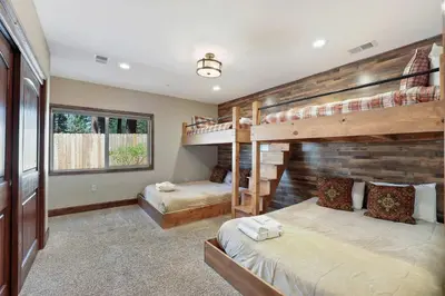 a bedroom with two bunk beds in a house at Tahoe Woods Villa - Walk to Beach and Gondola - Heavenly Ski in South Lake Tahoe