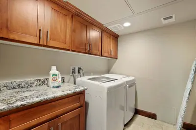 a small laundry room with a washer and dryer at Tahoe Woods Villa - Walk to Beach and Gondola - Heavenly Ski in South Lake Tahoe