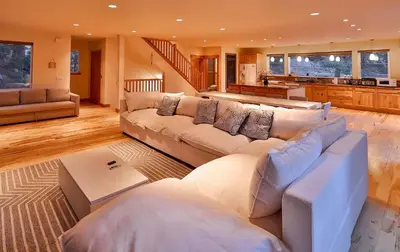 a large living room with couches and a kitchen at The Elevator House - Sleeps 10 in Stateline