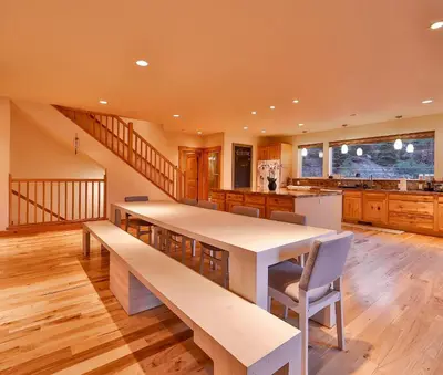 a large kitchen with a long table and chairs at The Elevator House - Sleeps 10 in Stateline