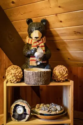a stuffed teddy bear standing on a shelf with food at Woodland Escape - Cute Little Cabin in the Woods in South Lake Tahoe