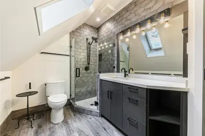 a bathroom with a sink and a toilet and a shower at Misty Pines by Tahoe Getaways at Tahoe Park - Newly Remodeled Pet Friendly 3 BR w Private Beach HOA in Tahoe City