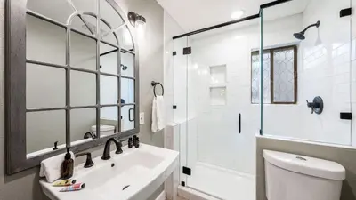 a bathroom with a sink and a toilet and a shower at Geraldine Drive by AvantStay Hot Tub Views Walk to Trails Game Room in Incline Village