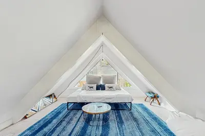 a room with a bed and a large window at Family Friendly! Incline Village Condo with Foosball in Tyrolian Village