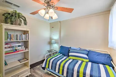 a bedroom with a bed and a ceiling fan at Beautiful Large close to Skiing / Wine Tasting! in Pioneer