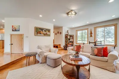 a living room with a couch and a table at 5 Mi to Northstar Resort! Family Home with Hot Tub in Truckee