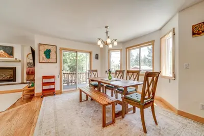 a dining room with a table and chairs at 5 Mi to Northstar Resort! Family Home with Hot Tub in Truckee