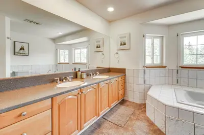 a large bathroom with two sinks and a tub at 5 Mi to Northstar Resort! Family Home with Hot Tub in Truckee
