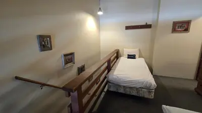 a small room with a bed in the corner at Eagle Summit Collection in Mammoth Lakes