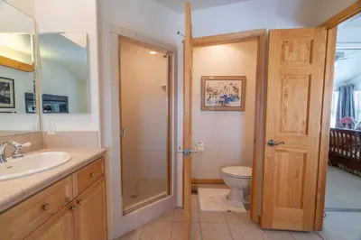 a bathroom with a toilet and a sink and a shower at RR-Hideaway_Down_Cyn 104 in June Lake