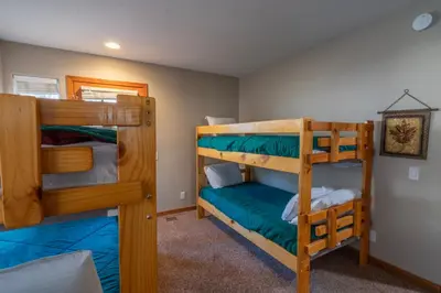 a bedroom with two bunk beds in a house at RR-Hideaway_Down_Cyn 105 in June Lake
