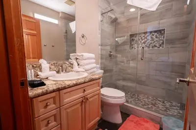 a bathroom with a toilet sink and a shower at RR-Hideaway_Down_Cyn 105 in June Lake