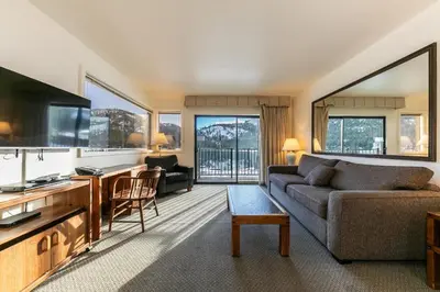a living room with a couch and a tv at 136 Bldg C condo in Truckee