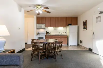 a kitchen and dining room with a table and chairs at 136 Bldg C condo in Truckee