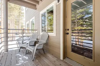 two chairs sitting on the porch of a house at Modern Kirkwood One Bedroom with Deck in Kirkwood
