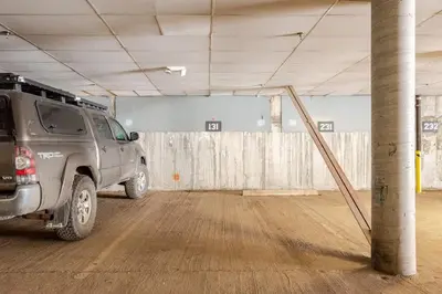 a truck parked in an empty parking garage at Modern Kirkwood One Bedroom with Deck in Kirkwood