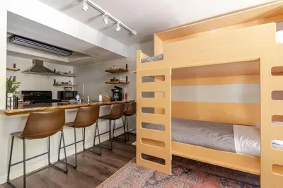 a room with bunk beds and a bar at Modern Kirkwood One Bedroom with Deck in Kirkwood