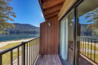 a balcony of a house with a view of a lake at 242 Bldg C condo in Truckee